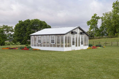 double wide greenhouse in grass field