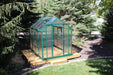 Aerial perspective of Grandio Element 6x8 greenhouse with twin-wall panels and green aluminum framework in a garden setting.